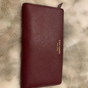 Burgundy Kate spade large slim bifold wallet
